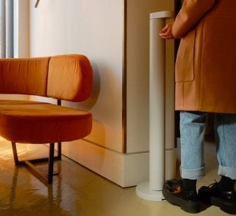 White Flaco at the entrance of a Store with someone approching to wash their hands